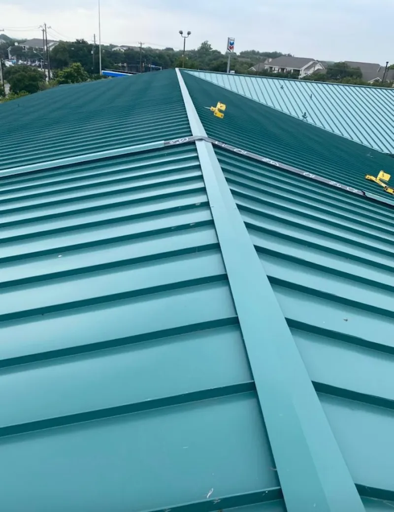 Green commercial metal roof ridge and valley for Metal Roof Repair in Brookside
